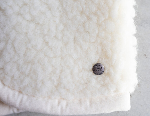 Baby- en kinderbodywarmer in naturel wol